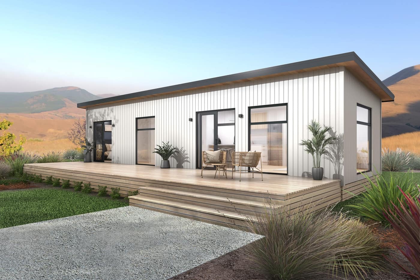 Exterior of a Paragon Portables one-bedroom portable home with white vertical cladding and a timber deck
