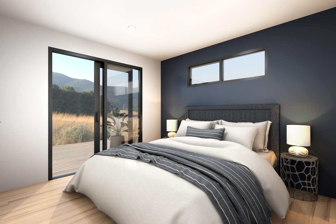 Modern bedroom interior with sliding glass doors opening to a deck in a Paragon Portables one-bedroom portable home